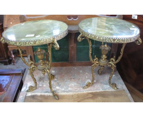 Pair of 20th Century gilt metal and onyx circular jardiniere stands on tripod legs. (2)