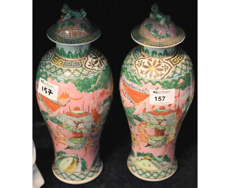 Pair of late 19th/early 20th Century Chinese porcelain vases and covers depicting warriors on a pink ground, having Dog of Fo