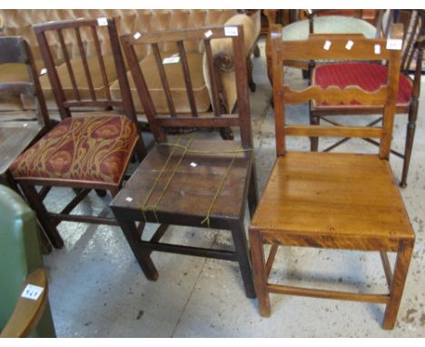 Two similar oak stick back farmhouse chairs together with another oak bar back farmhouse chair. (3)