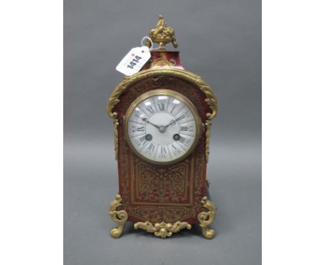 A Mid XIX Century French Boulle Mantle Clock, with ormolu mounts, the shaped rectangular body raised on scrolling hoof feet a
