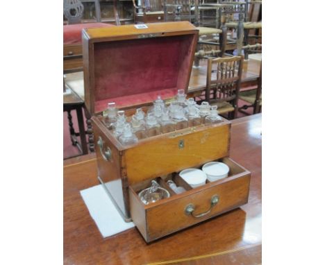 A Mid XIX Century Mahogany Apothecary Cabinet, the interior with eighteen various glass bottles and stoppers above a drawer c