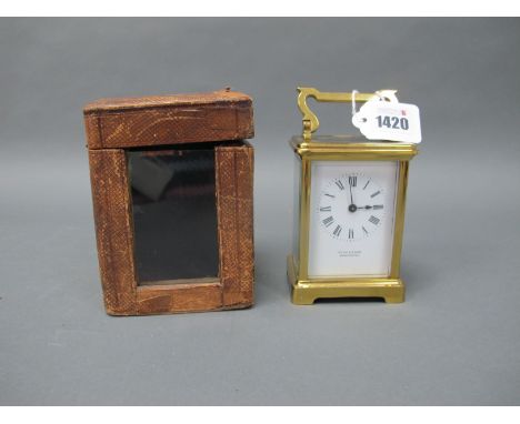 A Late XIX/Early XX Century Brass Carriage Clock, the white enamel dial with Roman numerals, inscribed 'Ross and Sons, Winche
