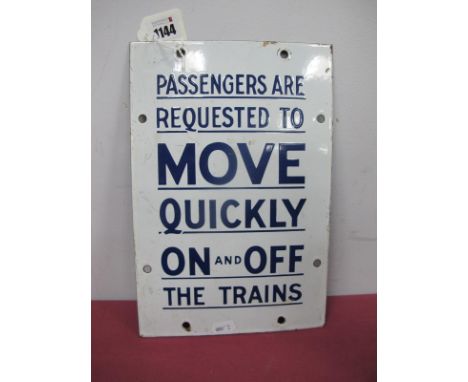 A Vintage Enamel Railway Sign, the blue lettering inscribed "Passengers are requested to move quickly on and off the trains" 