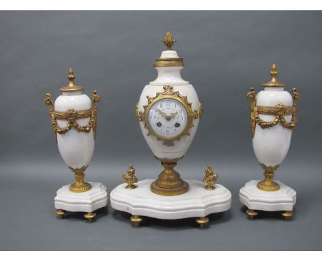 A Late XIX Century French Clock Garniture, the clock with white alabaster case with ormolu mounts, the baluster body with pin