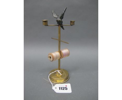 A Late XIX Century Brass Bobbin Stand, surmounted by a speltre bird with two taperstick holders and four branches raised on a