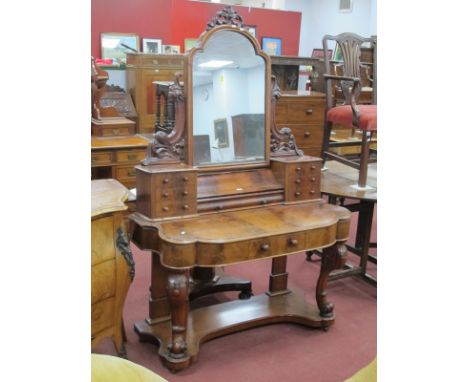 A XIX Century Duchesse Dressing Table, with central mirror, shaped supports and jewel drawers, the base with a central drawer
