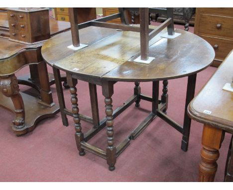 A Late XVIII Century Gateleg Table, with oval top on bobbin supports,106 x 122cm open.