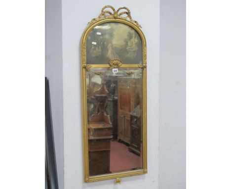A XX Century Gilt Wall Mirror, the top with applied ribbon decoration, beadwork frame and bevelled glass.