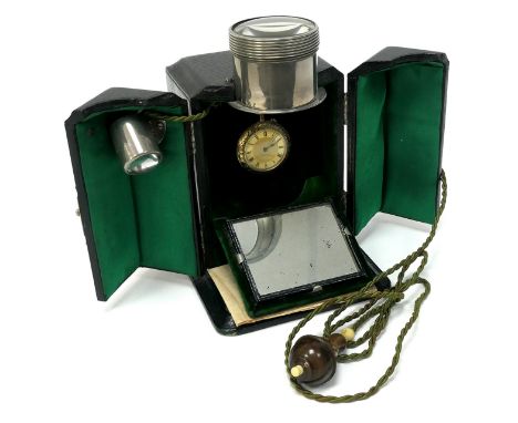 A Late XIX/Early XX Century Ever Ready Electric Ceiling Watch Stand, the black case opening out to reveal a pull down mirror,