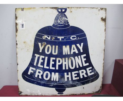 A Vintage Enamel Sign, decorated to both sides with a bell in blue and inscribed "N.T.C. You May Telephone From Here" against