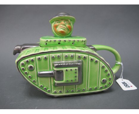 An Art Deco Pottery Teapot and Cover Modelled in the Form of a Tank, the cover with head finial, and decorated in lime green 