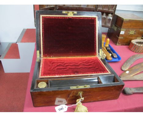 A Mid XIX Century Rosewood Rectangular Writing Box, with central brass cartouche, the red velvet interior with inkwell, pen t