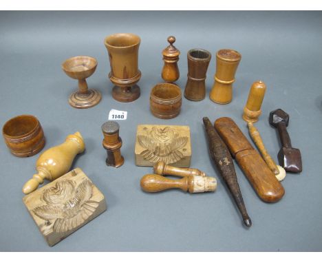 A Selection of Treen, to include: butter moulds, pastry marker, bird whistle, goblet, bobbin holder, needle case, pair of nap