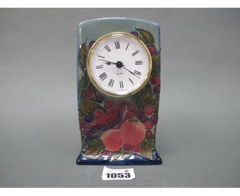 A Modern Moorcroft Mantle Clock, painted in the 'Finches' pattern against a shaded blue ground, impressed marks, 15.5cm high.