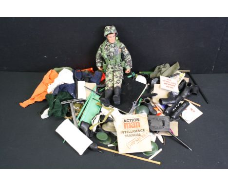 One dressed Action Man figure with a quantity of accessories, to include clothing, weapons, life raft, skis etc 