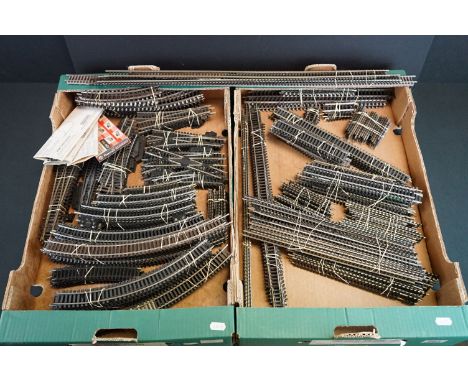 Quantity of OO gauge model railway track featuring various straights and curves, separated into sets (two boxes) 