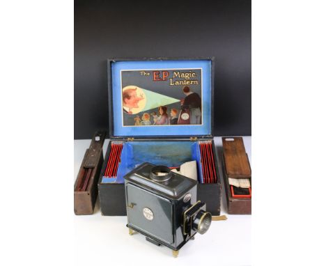 The EP Magic Lantern 'Lanterna Magica' with instructions, slides and paperwork plus 2 x additional wooden cases of slides 