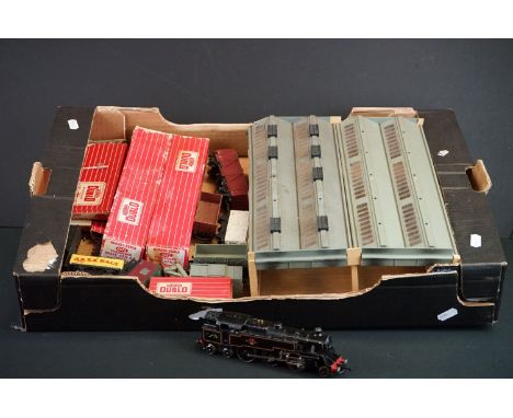 Quantity of Hornby Dublo model railway to include 2-6-0 locomotive, 3 x boxed items of rolling stock, 8 x unboxed items of ro