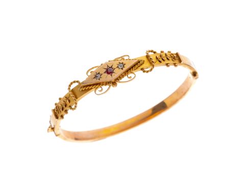 An Edwardian 9ct gold red gem and rose-cut diamond hinged bangle, with rope-twist and floral cannetille highlights, hallmarks