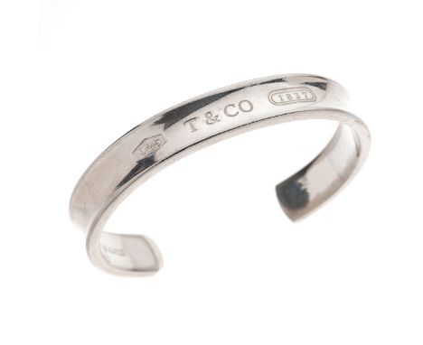 Tiffany & Co., a silver 1837 cuff bangle, signed 1997 Tiffany & Co. 925, inner diameter 6.7cm, 39.2gCondition- Overall good t