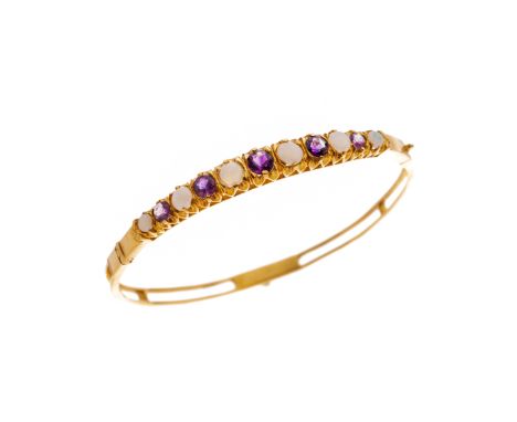 An 18ct gold opal cabochon and amethyst hinged bangle, with openwork reverse, inner diameter 5.7cm, 12.2gCondition- Overall g