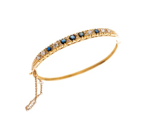An 18ct gold sapphire and brilliant-cut diamond hinged bangle, with single-cut diamond double spacers, estimated total diamon
