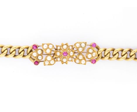 An Edwardian 15ct gold ruby and split pearl floral bracelet, with curb-link chain and push-piece clasp, stamped 15ct, 18cm, 2