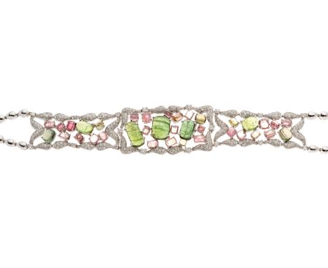 An 18ct gold green and pink tourmaline cabochon, and brilliant-cut diamond openwork bracelet, principal three tourmalines est