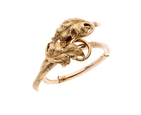 A 9ct gold floral engraved hinged bangle, import marks for Birmingham, hinge at fault, inner diameter approximately 5.2cm, 17