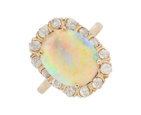 An early 20th century gold, opal cabochon and old-cut diamond cluster ring, estimated total diamond weight 0.80ct, I-J colour