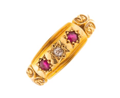 An early 20th century 18ct gold ruby and old-cut diamond three-stone ring, with scrolling shoulders, hallmarks for Chester, p