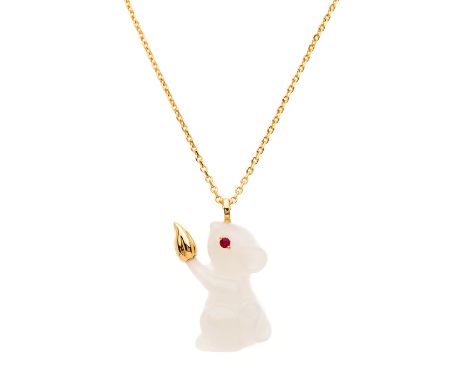 An 18ct gold carved white nephrite jade novelty pendant, designed as a mouse holding a nut, with ruby eye detail, suspended f