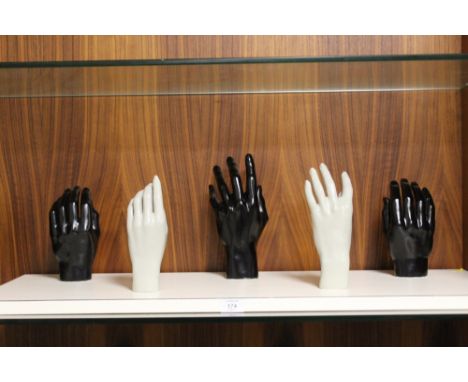 AN UNUSUAL MANNEQUIN HAND WALL MOUNTED COAT RACK