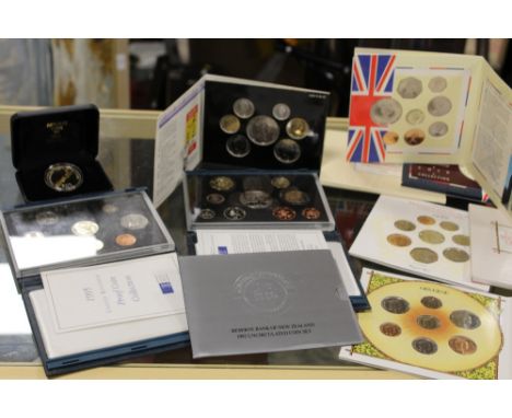 A LARGE QUANTITY OF COLLECTORS COIN SETS TO INCLUDE UNCIRCULATED SETS (ENTIRE SHELF)