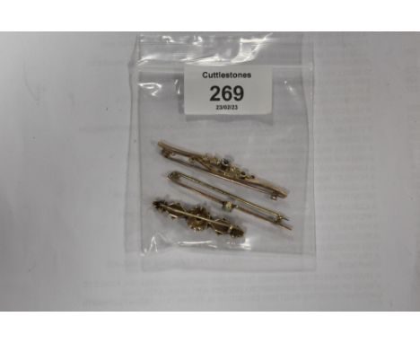 THREE BROOCHES TO INCLUDE A 15CT EXAMPLE AND AN UNMARKED OPAL SET EXAMPLE