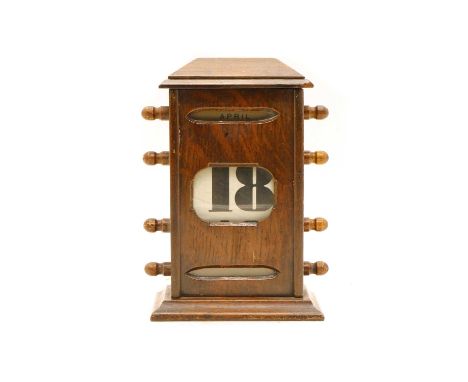 Early 20th Century Oak Perpetual Calendar, featuring a three tier format of month, date and day with roller handles and glass