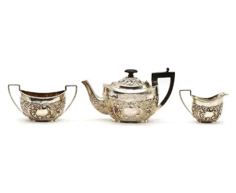 A three piece Victorian silver tea set, by William Neal, Chester, 1900, comprising a teapot, with ebony handle and finial, a 