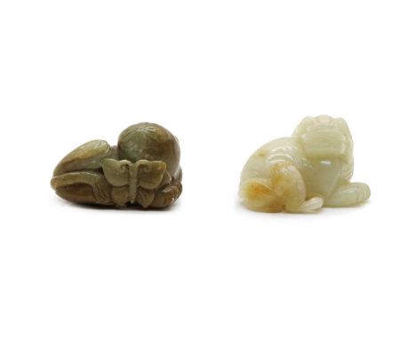 Two Chinese jade carvings, comprising: one recumbent Buddhist lion, with its pup to the side, 6.5cm long, and a recumbent cat