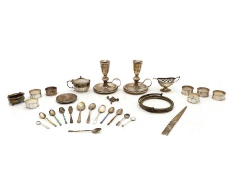 A collection of silver items, to include a set of six napkin rings, a compact, paper knife, three cruets, six enamel coffee s