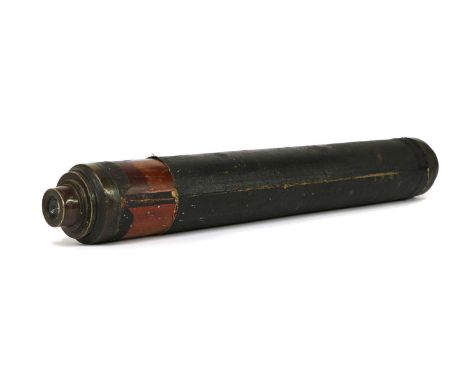 A brass telescope by Watkins, Charing Cross, in a mahogany case, covered with black turned canvas, 50cm long closed Provenanc