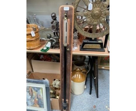 A black lacquered and brass barometer, signed F.Darton and Co Limited, London, on a hardwood board. 115cm high overall&nbsp;
