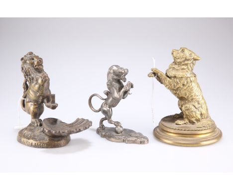 A Victorian cast brass novelty inkwell in the form of a begging dog, 16cm high&nbsp;(a/f); a cast iron armorial stand of a li