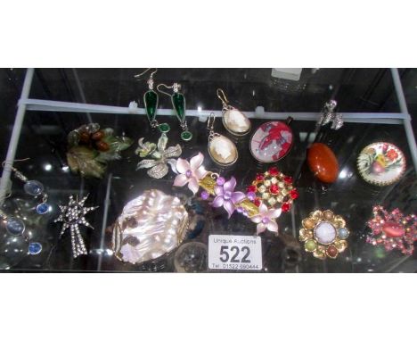 A mixed lot of vintage brooches, earrings etc.,