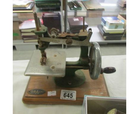 A vintage toy sewing machine.