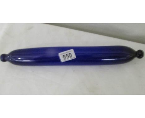 A Bristol blue glass rolling pin.