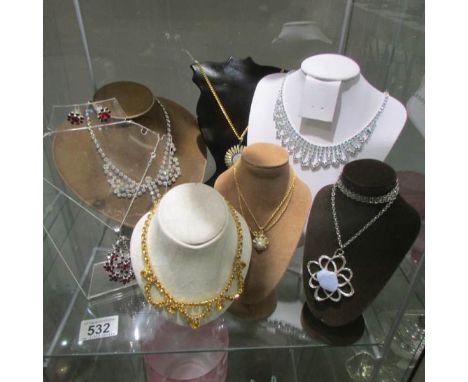 A mixed lot of vintage necklaces, (stands not included).