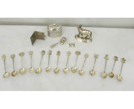 14 coffee spoons with coat of arms finial's, a trinket box, a miniature photo frame, a figure of a cow with calf and a babies
