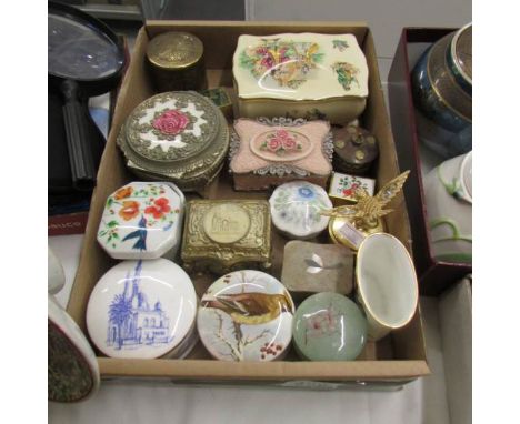 A mixed lot of interesting trinket and pill boxes in metal and china.