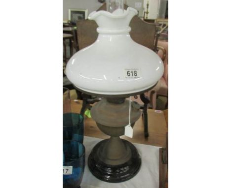 A Victorian brass oil lamp complete with shade.