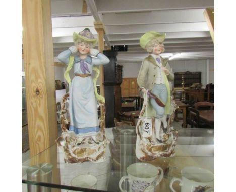 A pair of 19th century continental bisque porcelain figures, in good condition.